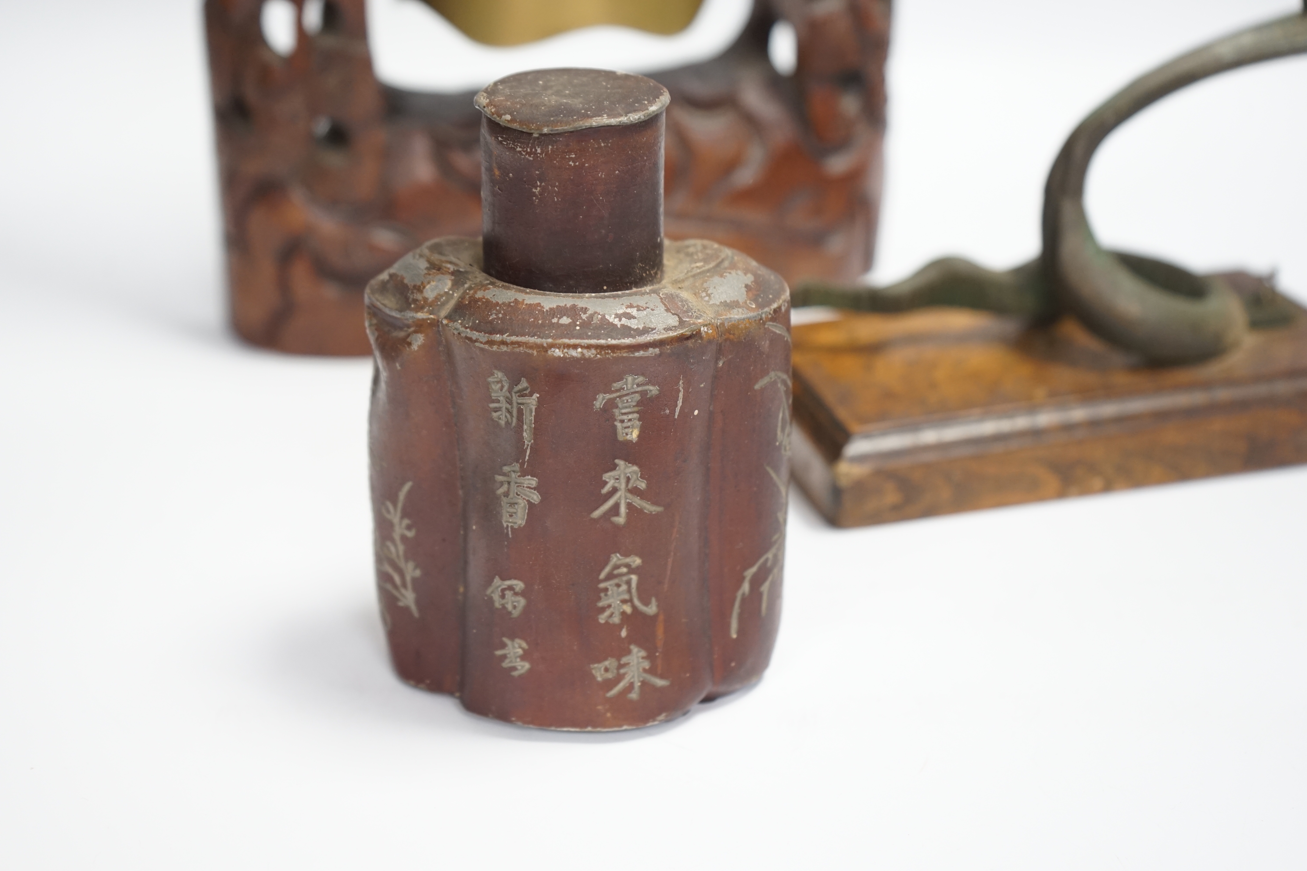 A Chinese table bell, pewter tea canister and an Indian ‘cobra’ hook, bell in frame 34.5cm high